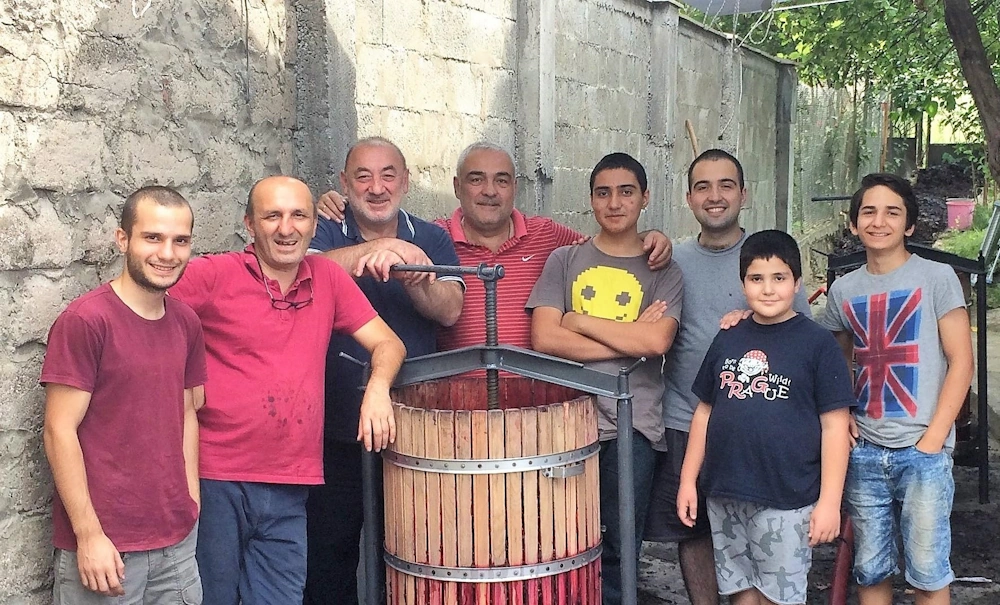 Family and friends at winepress